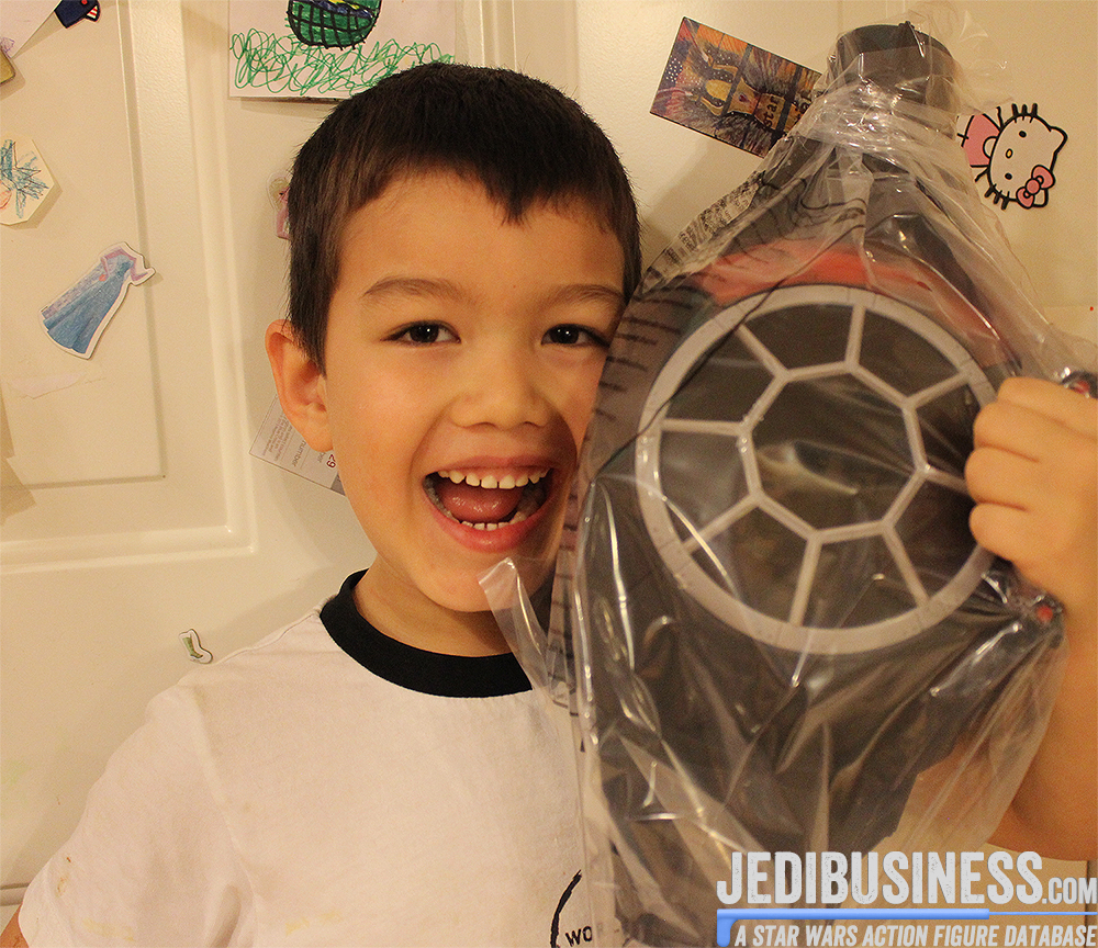 Evan holding the black series Tie Fighter